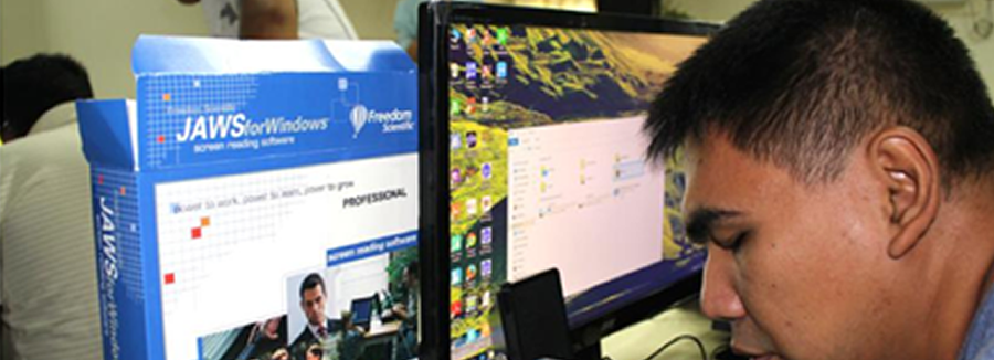 adult blind man reading so close from the computer screen